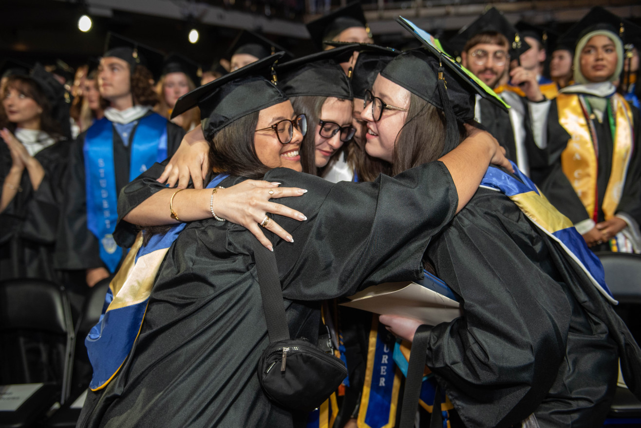 three women hug 