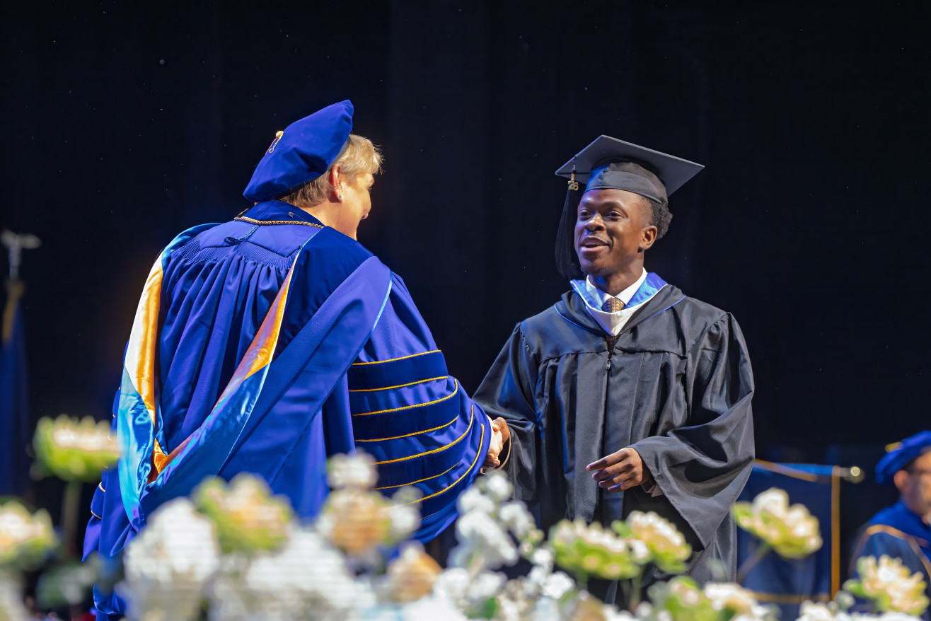 President Ross confers a degree
